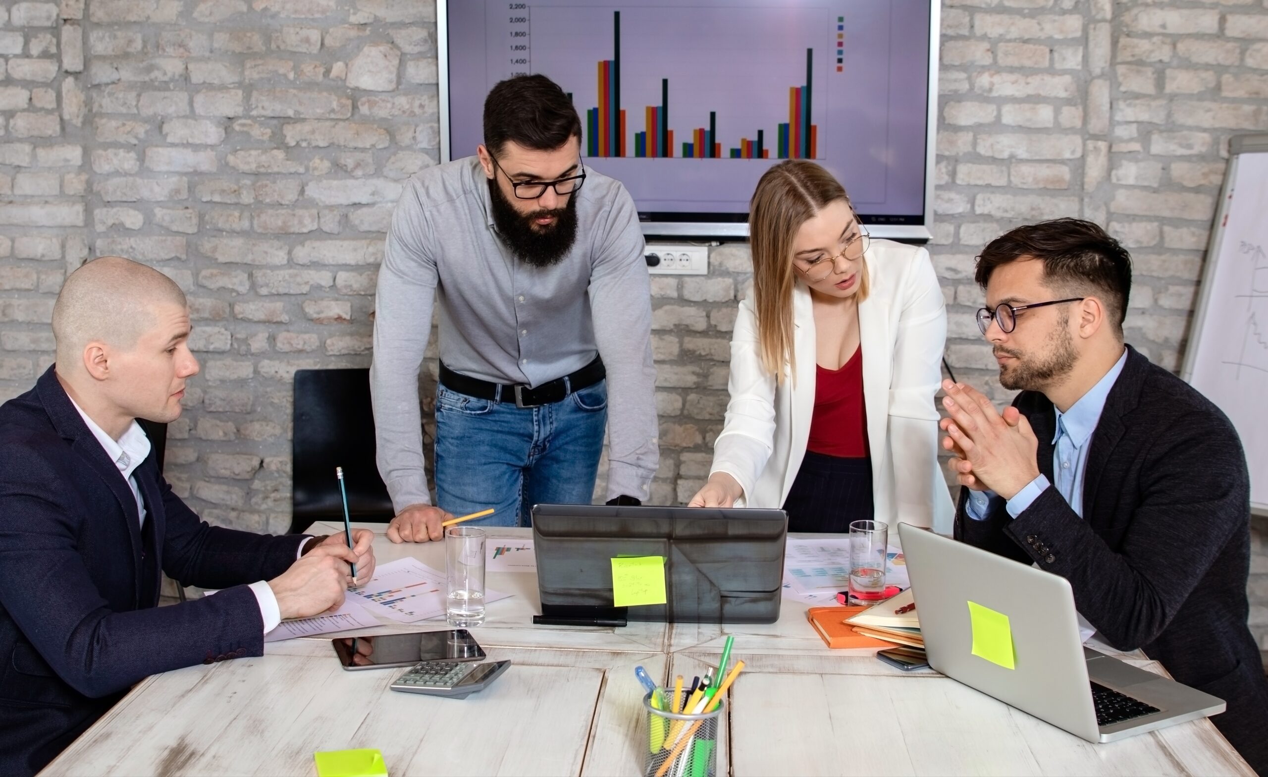 Successful business partners having a meeting and discussing new business project ideas in an office